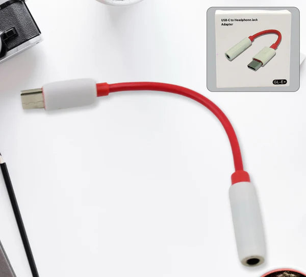 USB-C to headphone jack adapter with red and white design on a white background