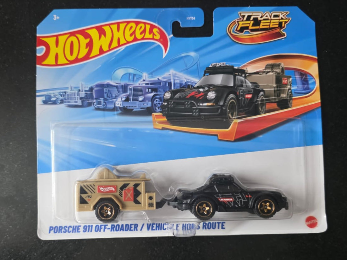 Hot Wheels toy car packaging on a black surface