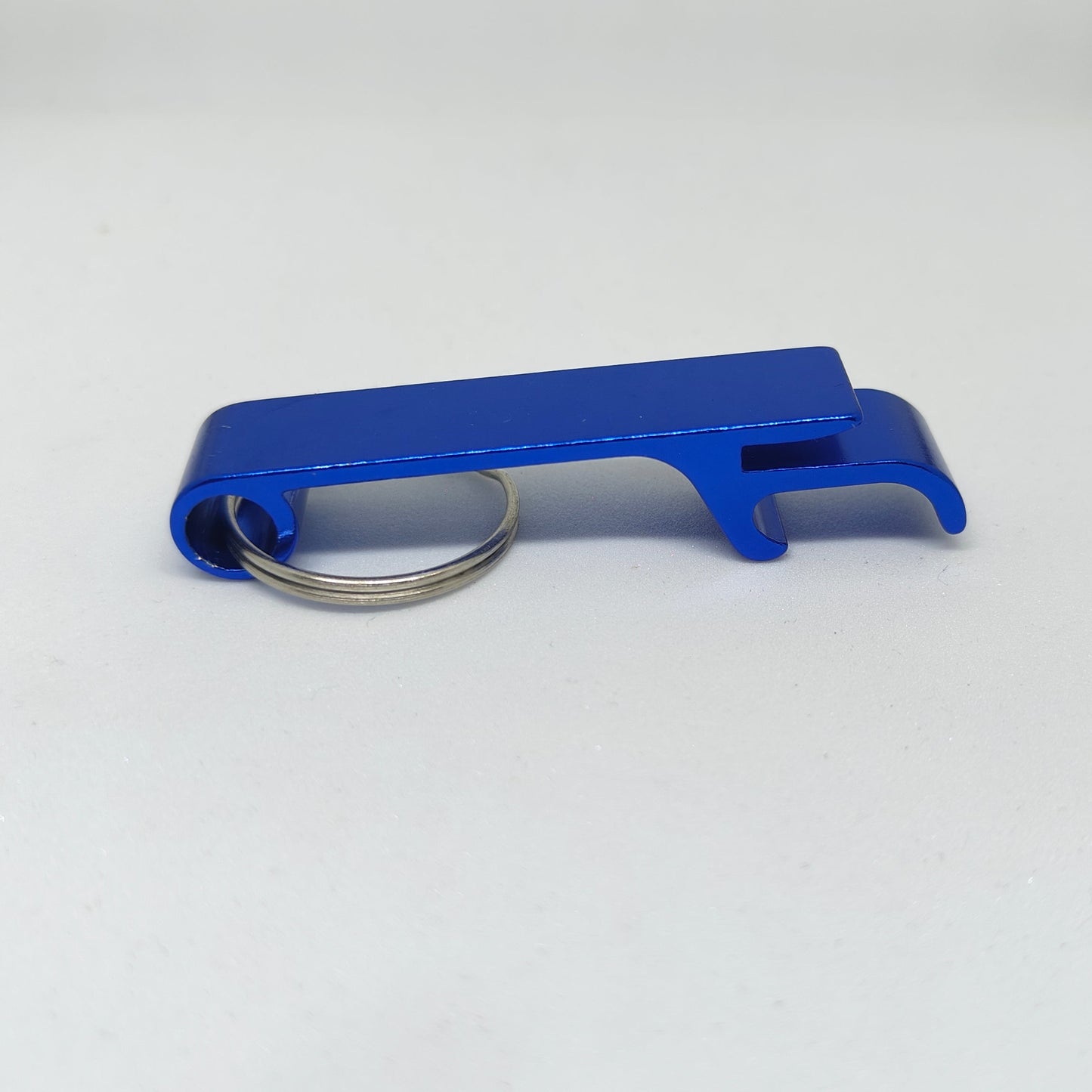 Blue bottle opener keychain on a white background