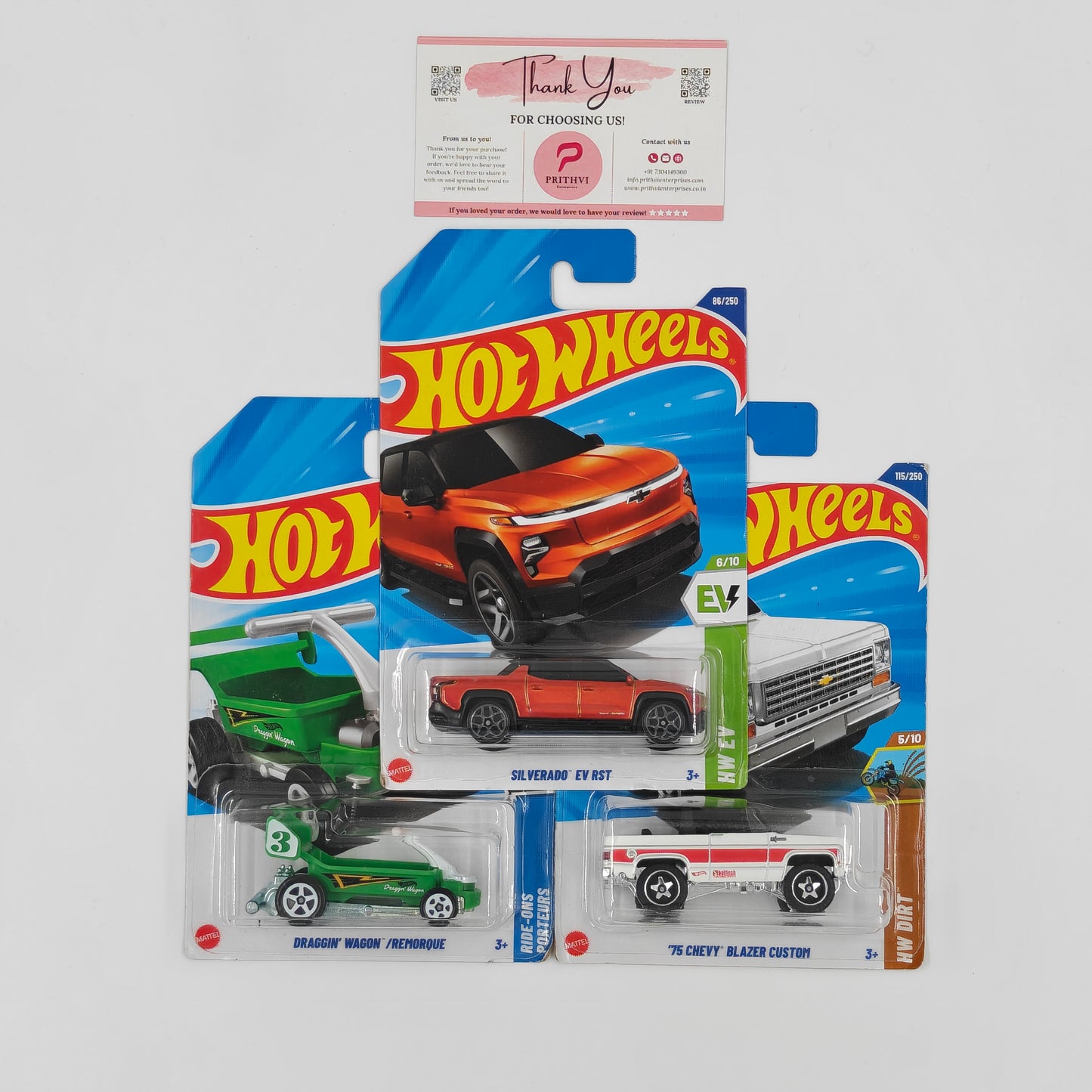 Hot Wheels Bundle – Draggin' Wagon, Silverado EV RST & '75 Chevy Blazer Custom by Mattel