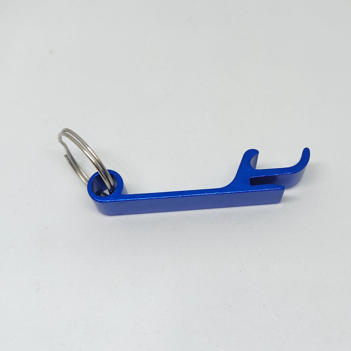 Blue bottle opener keychain on a white background