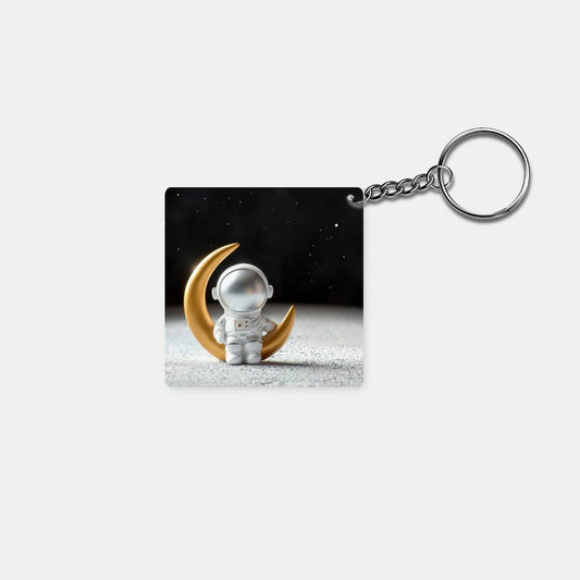 Abstract - Astronaut Sitting on Moon: Printed Square Keychain - Prithvi Enterprises