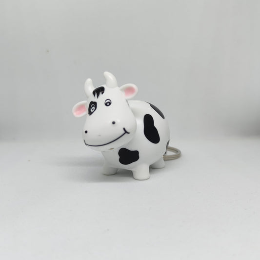 Cow-shaped toy on a gray background
