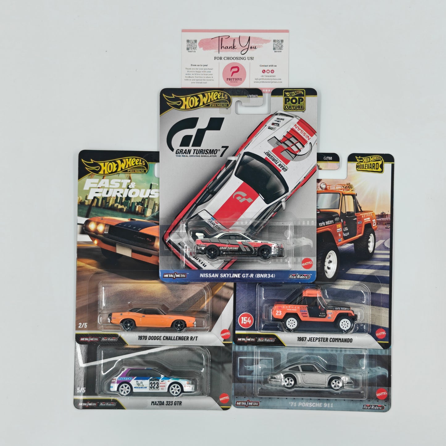 Nissan Skyline GT-R (BNR34) (Gran Turismo 7), 1970 Dodge Challenger R/T (Fast & Furious), Mazda 323 GTR (Fast & Furious), 1967 Jeepster Commando & '71 Porsche 911 by Mattel – Hot Wheels Premium Bundle